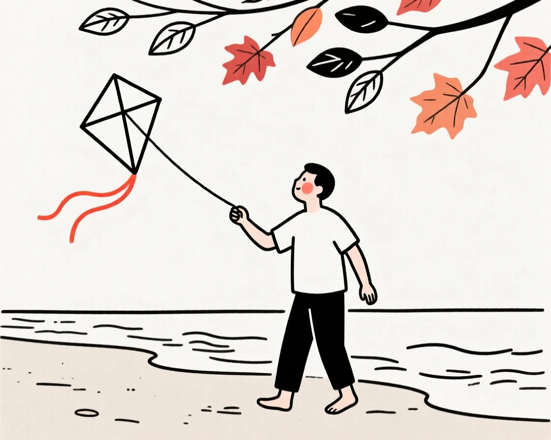 A father flying a kite on a windy beach, under a canopy of autumn leaves.
