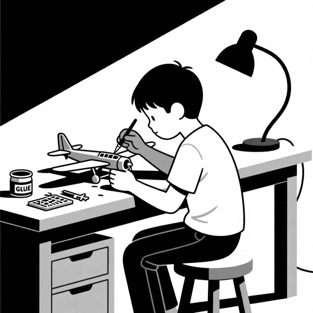 A boy building a model airplane at a workbench.