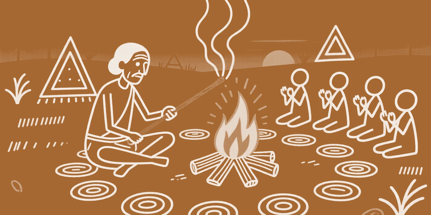 An elder lighting a sacred fire around a ceremonial bonfire at dusk.
