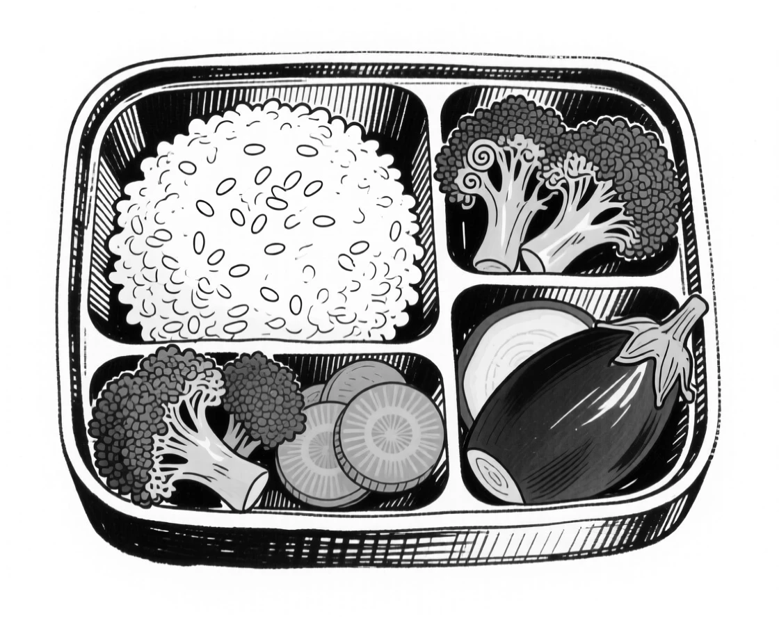 A plate of colorful bento box arranged neatly with rice and vegetables.