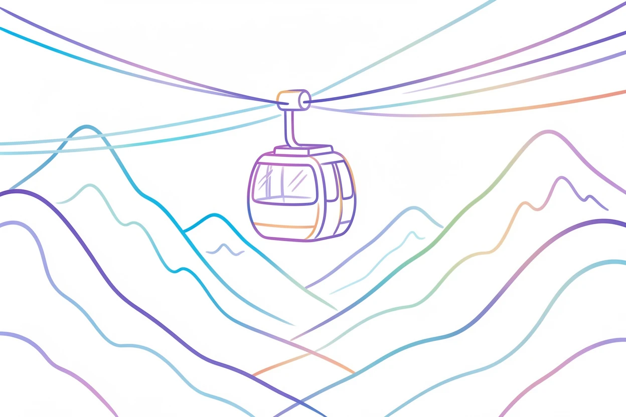 A cable car crossing high above a snow-covered mountain valley.