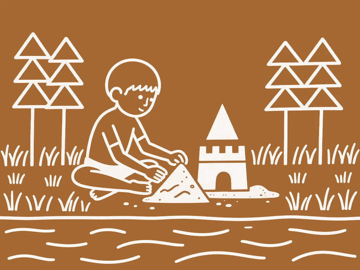 A shy young boy building a small sandcastle by a riverbank.