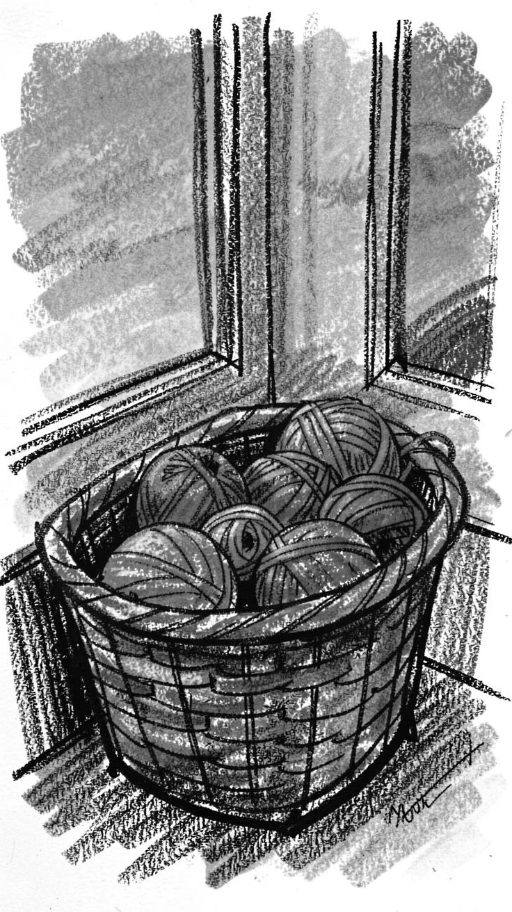 A knitting basket filled with colorful yarn beside a window, as the last light of day fades to dusk.