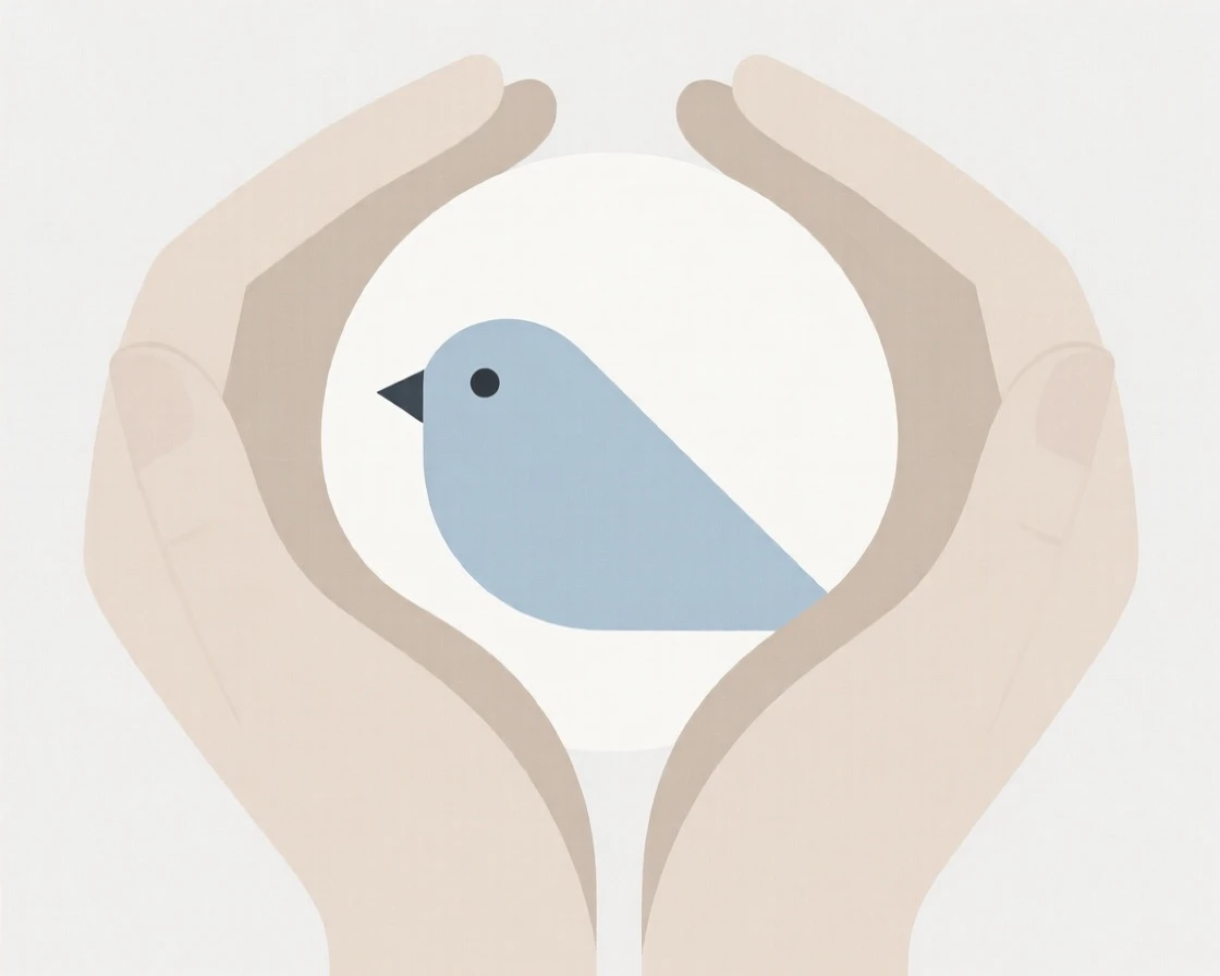 A pair of hands cradling a small bird