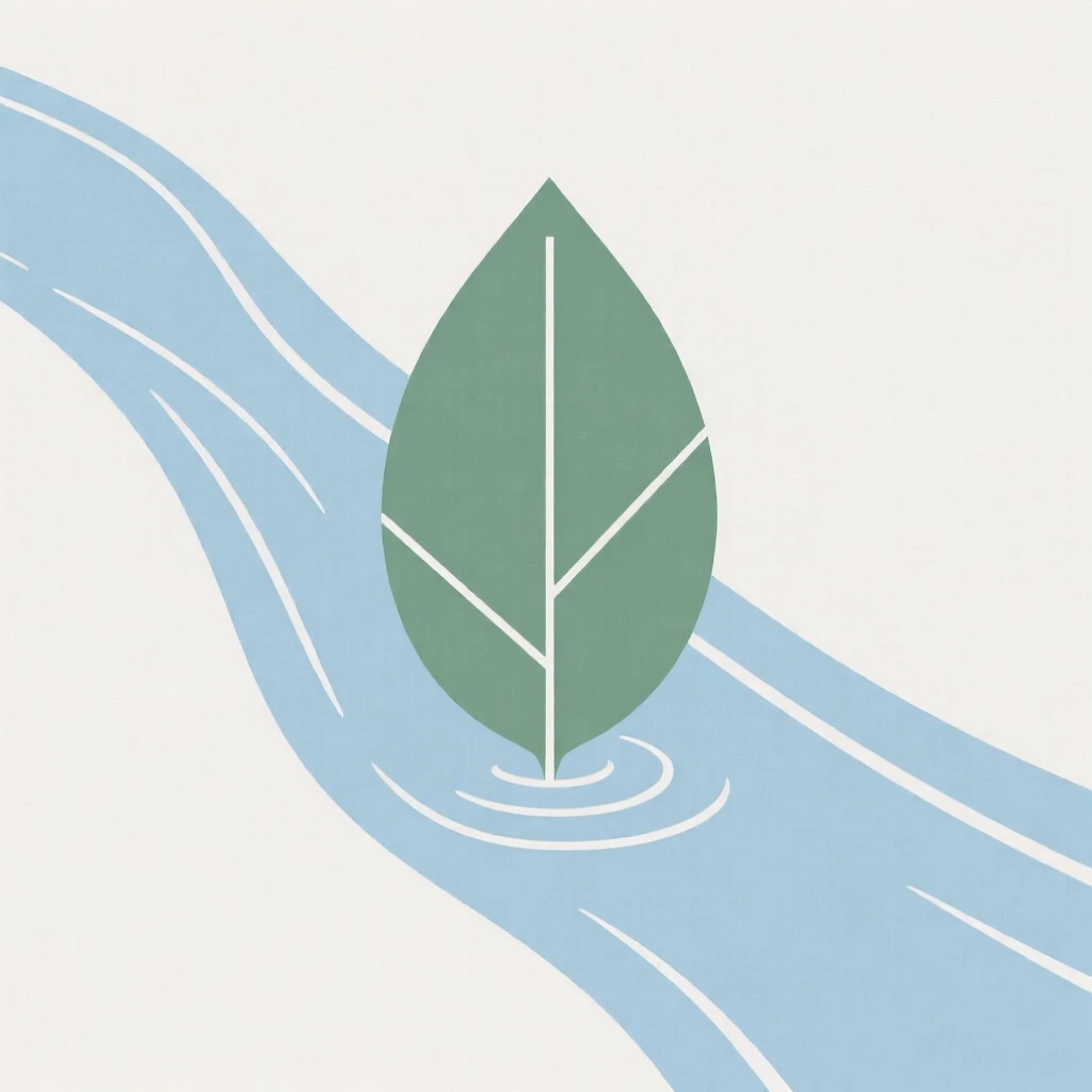 A single leaf floating gently down a stream