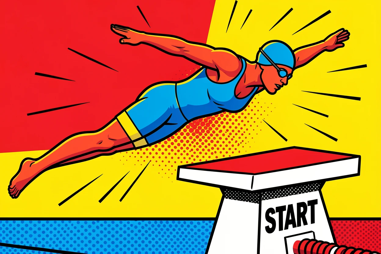 A swimmer diving cleanly off the starting block