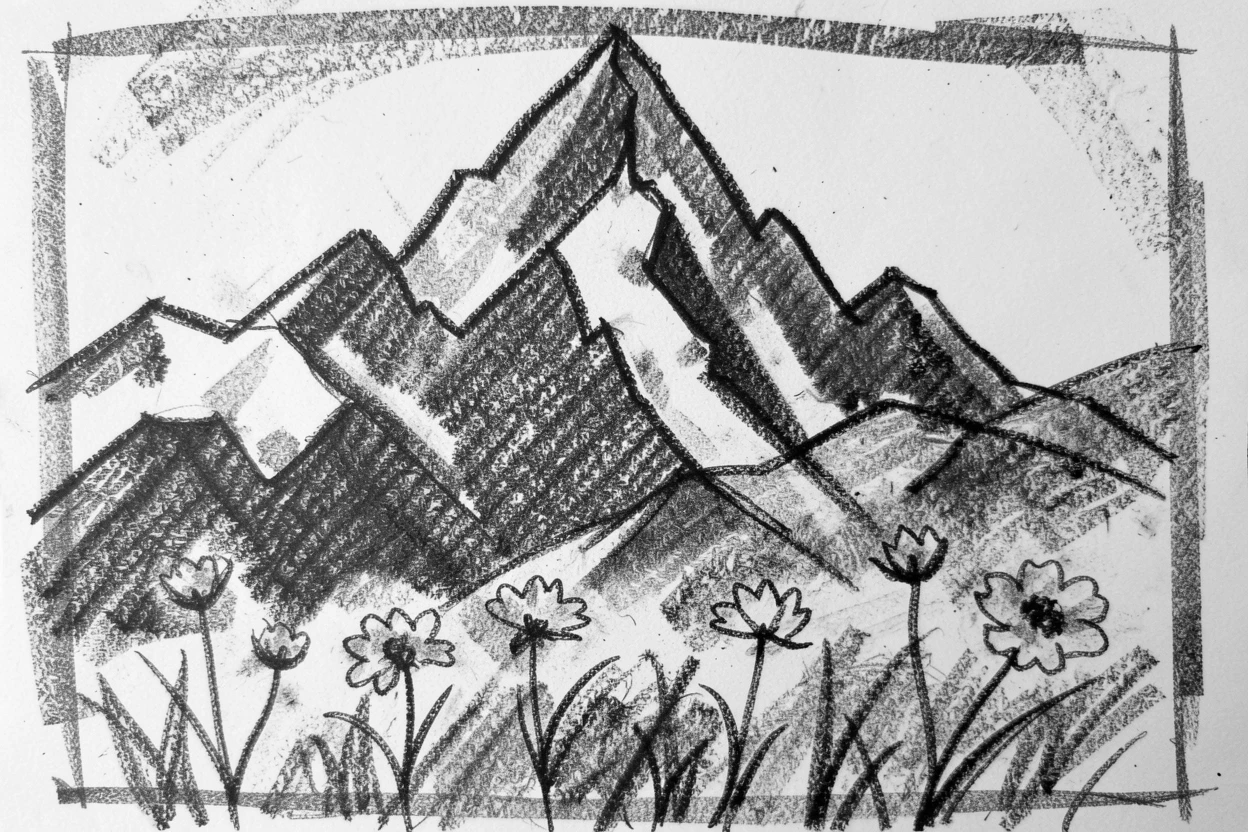 A snow-capped peak with wildflowers scattered across the foreground.
