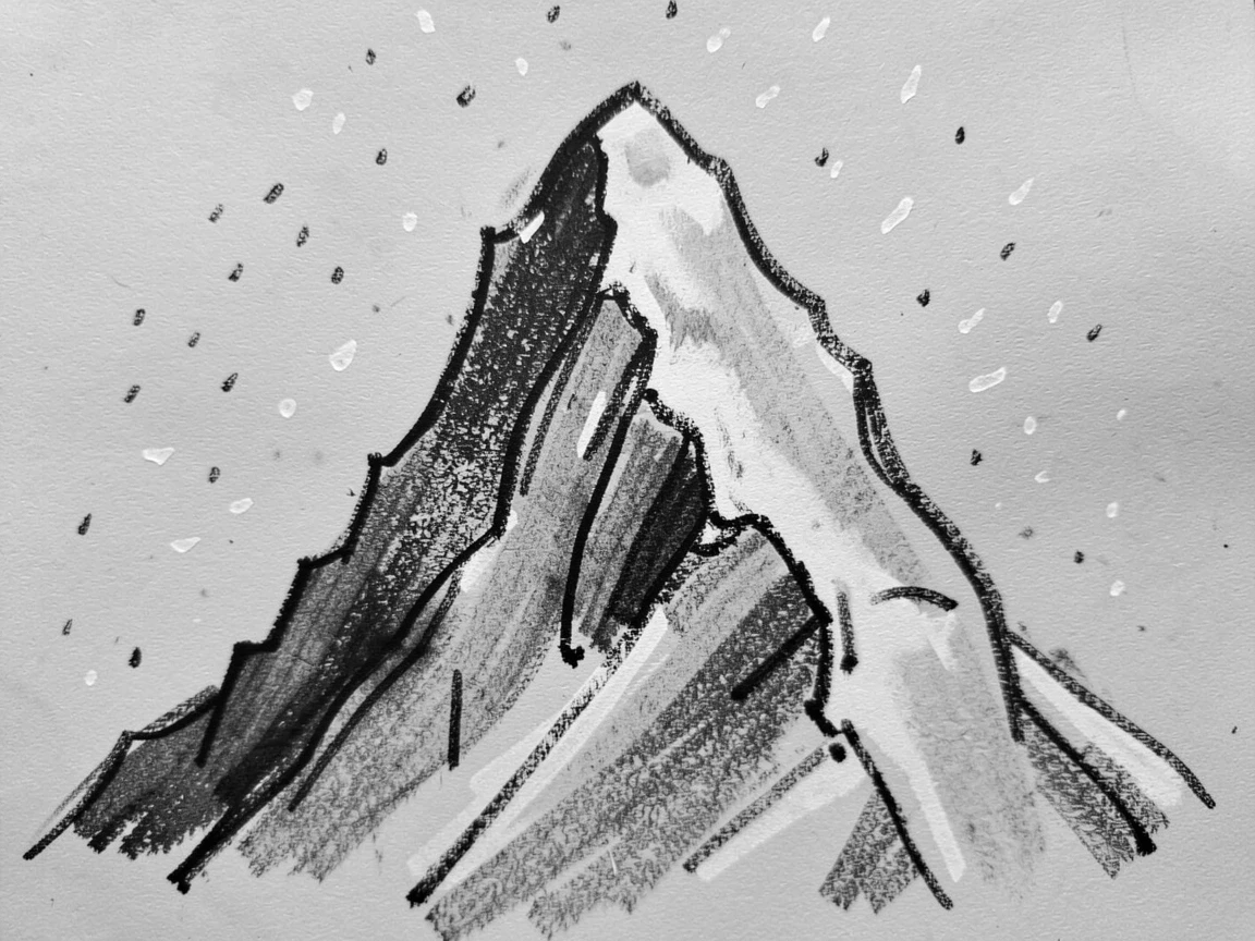 A snow-capped peak as a light snow begins to fall.