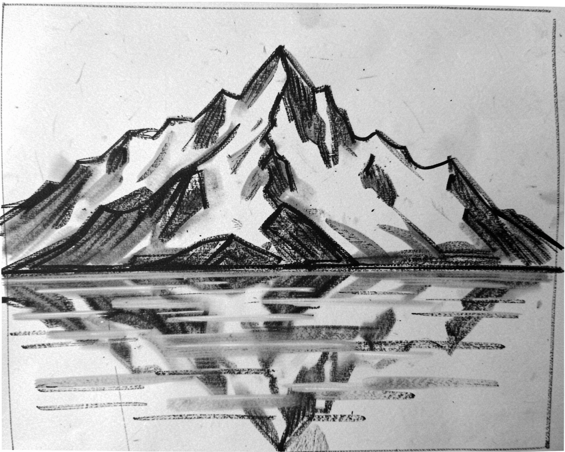 A snow-capped peak reflecting perfectly in still water below.