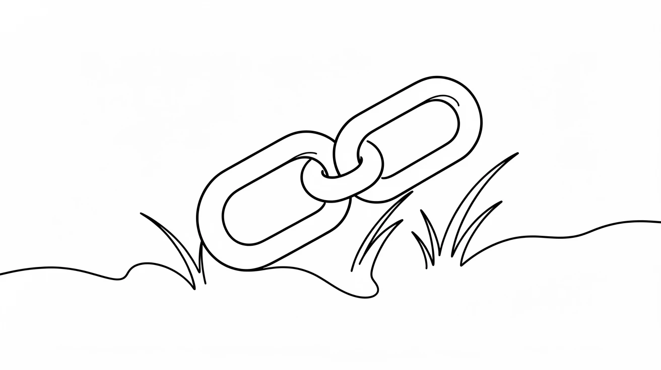 A broken chain link lying open in the grass, representing liberation