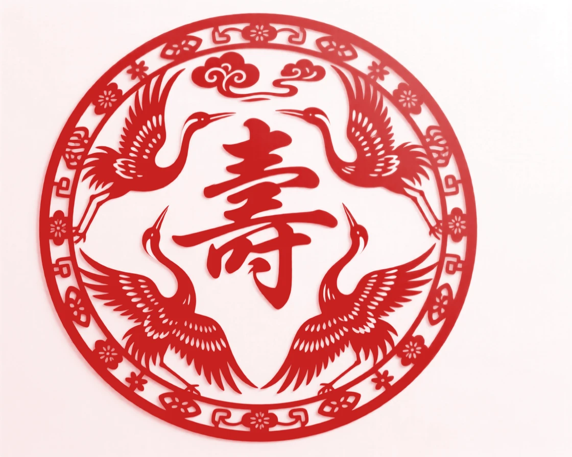 A circular medallion of five cranes surrounding a longevity character in elegant calligraphy